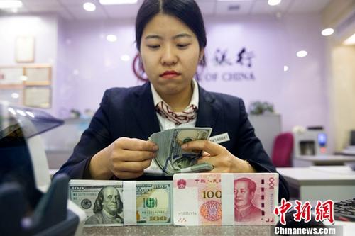 IMF挺人民币稳定 专家称中国未操纵汇率再获支持