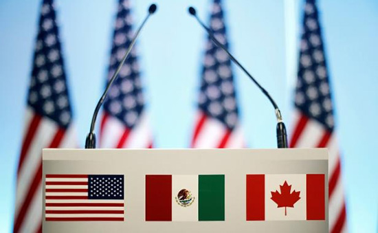 the-flags-of-canada-mexico-and-the-u-s-are-seen-on-a-lectern-before-a-joint-news-conference-on-the-c_42053_.jpg